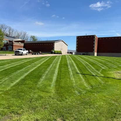 Clean cut lines across a large open lawn